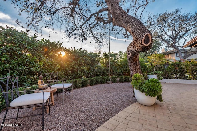 view of patio terrace at dusk