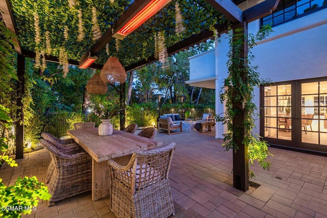 view of patio / terrace featuring a bar and french doors