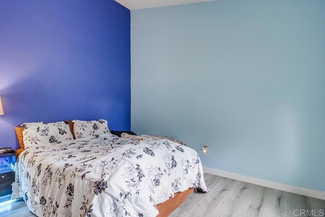 bedroom featuring light wood-type flooring