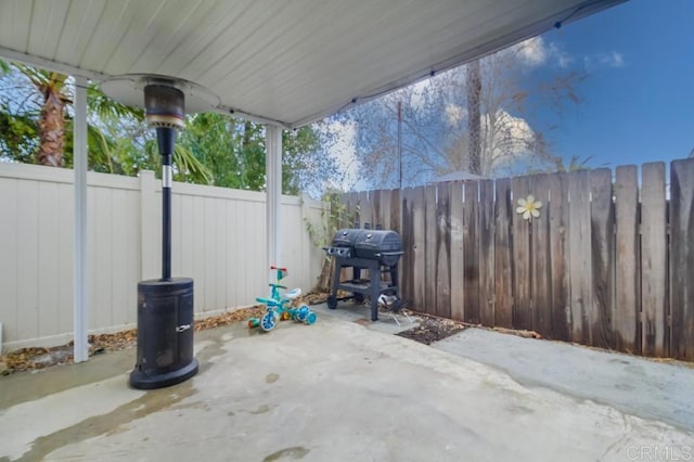 view of patio with a grill