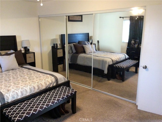 carpeted bedroom with a closet