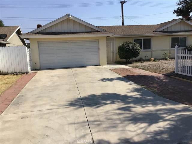 single story home featuring a garage