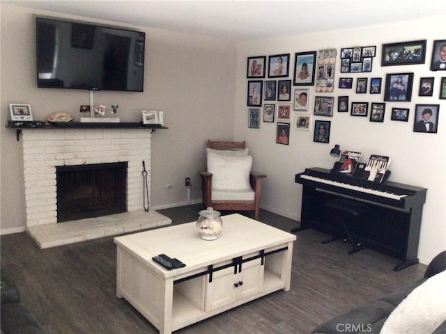 living room featuring a fireplace and dark hardwood / wood-style flooring