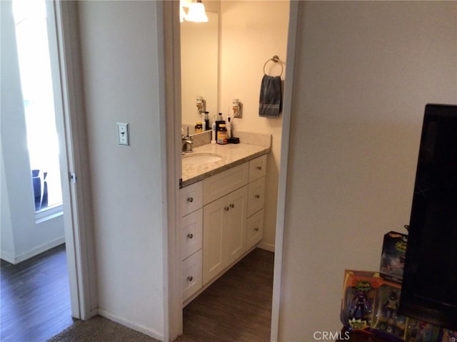 bathroom featuring vanity and wood-type flooring