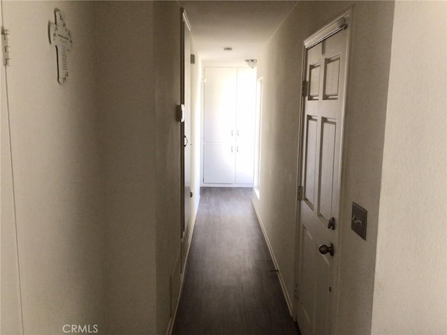 hall with dark hardwood / wood-style floors