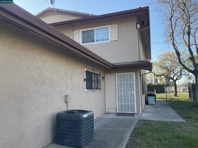 exterior space featuring cooling unit and a patio area