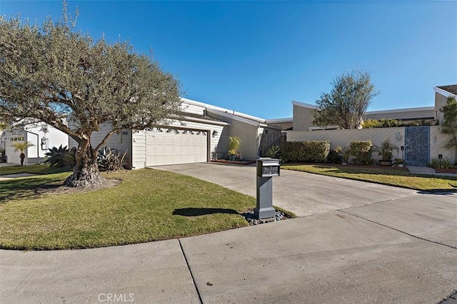 ranch-style house with a garage and a front yard