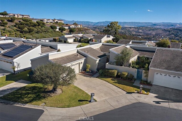 birds eye view of property with a mountain view