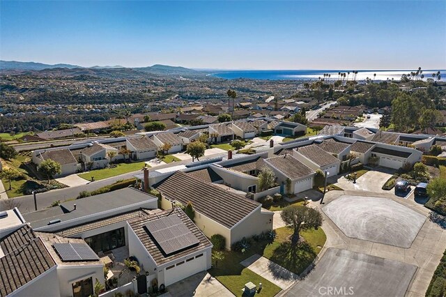 bird's eye view with a water and mountain view