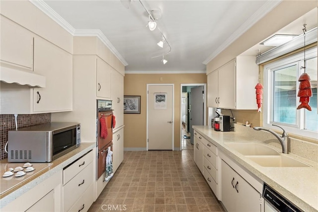 kitchen with sink, ornamental molding, dishwasher, white cabinets, and backsplash