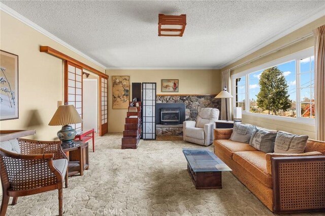 living room with ornamental molding, carpet floors, and a textured ceiling