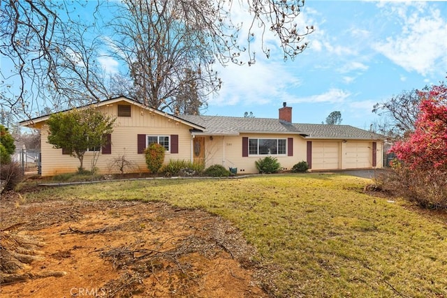 single story home featuring a garage and a front lawn