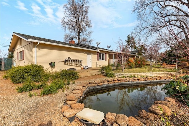 rear view of house with a patio