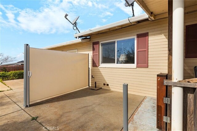 view of property exterior with a patio