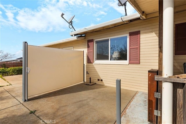 view of side of home with a patio