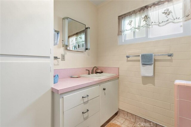 bathroom with vanity and tile patterned floors