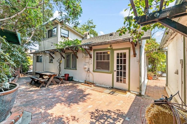 back of property featuring a patio area