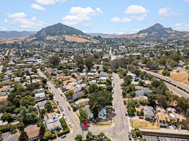 birds eye view of property with a mountain view