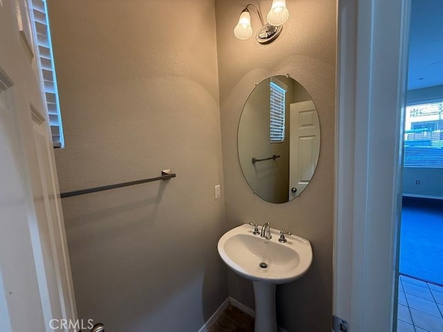 bathroom featuring sink and tile patterned flooring