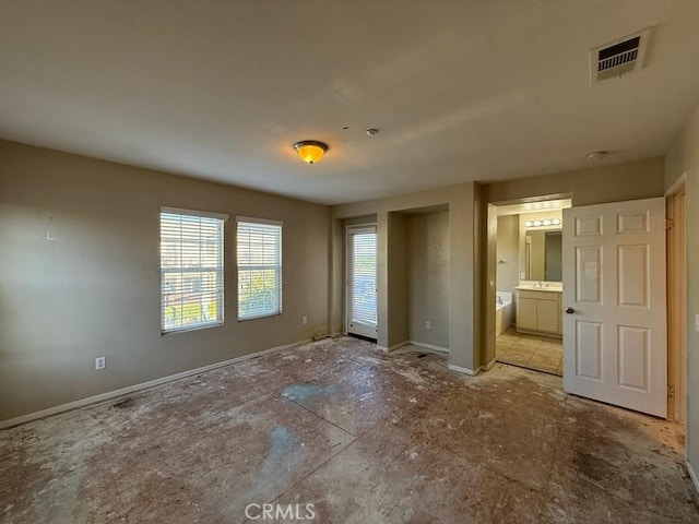 unfurnished bedroom with ensuite bath