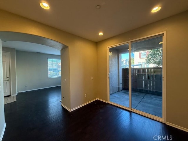 spare room featuring hardwood / wood-style floors