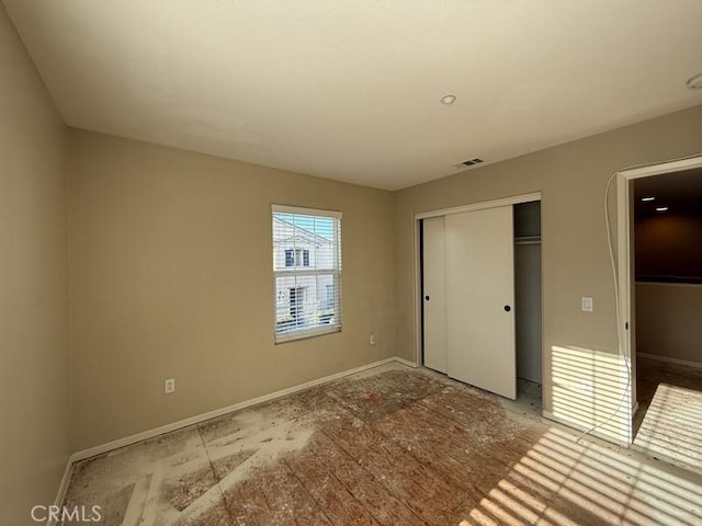 unfurnished bedroom with a closet