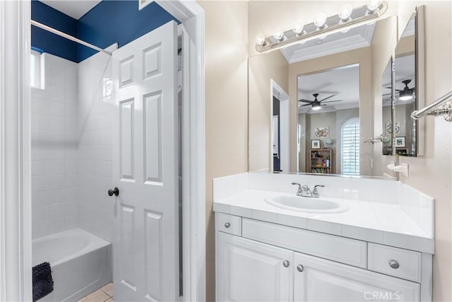 bathroom with tile patterned flooring, vanity, ceiling fan,  shower combination, and crown molding