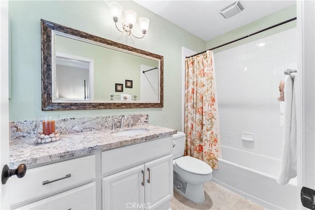 full bathroom with shower / tub combo with curtain, vanity, tile patterned floors, and toilet