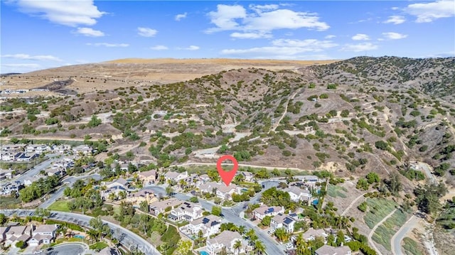 birds eye view of property featuring a mountain view