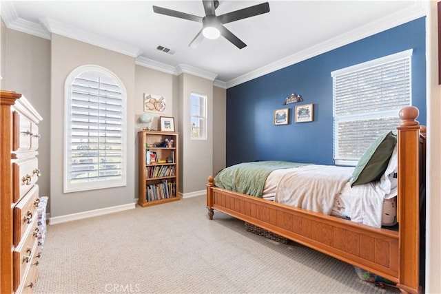 bedroom featuring multiple windows, ornamental molding, light carpet, and ceiling fan