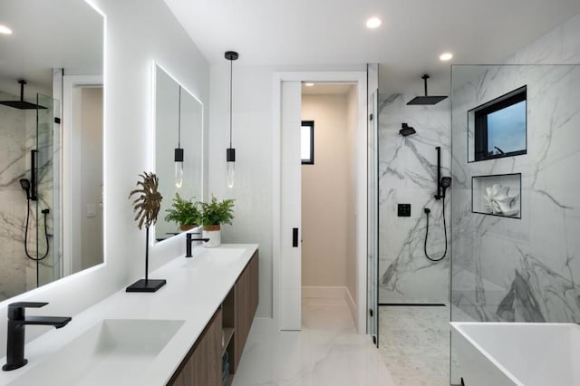 bathroom with vanity and a tile shower