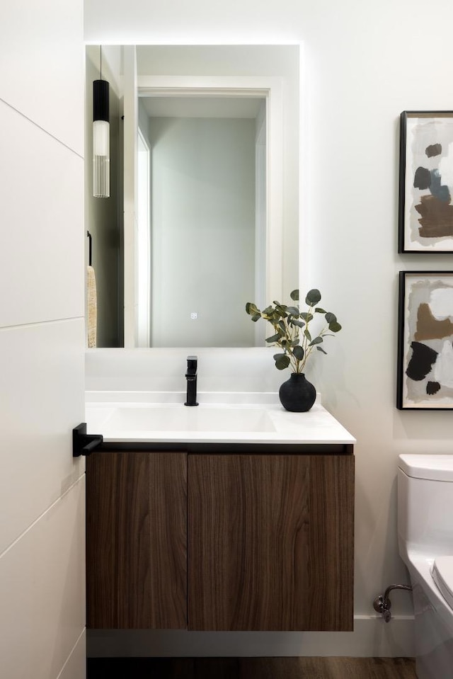 bathroom with vanity and toilet