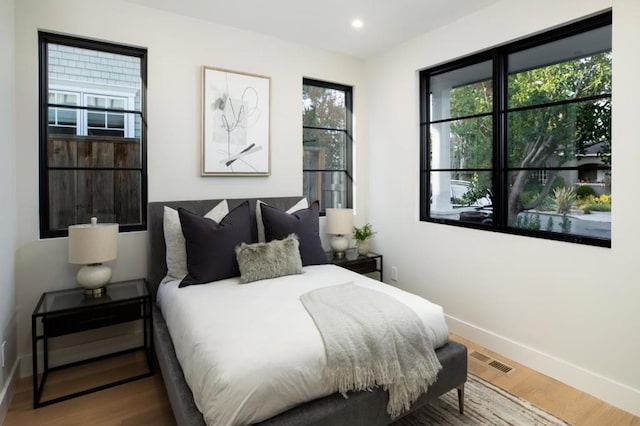 bedroom featuring wood-type flooring