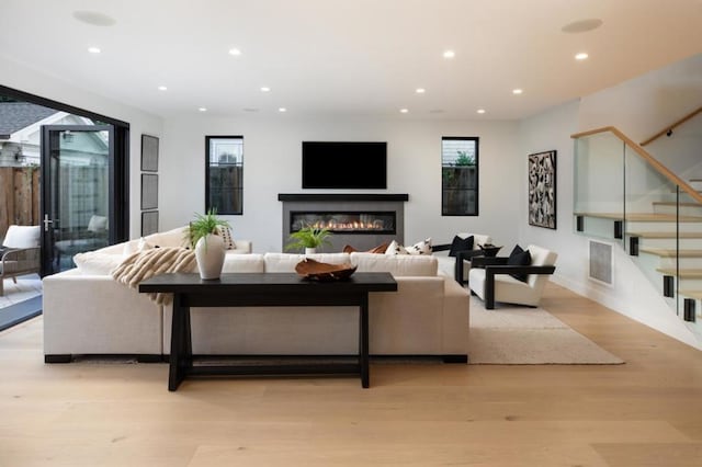 living room with light hardwood / wood-style flooring