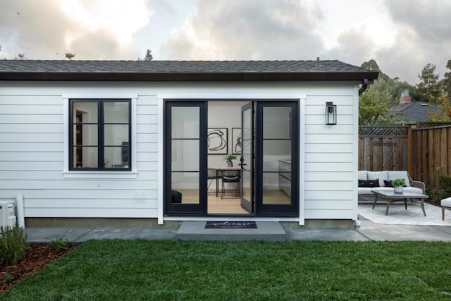 exterior space with a patio, an outdoor hangout area, and a yard