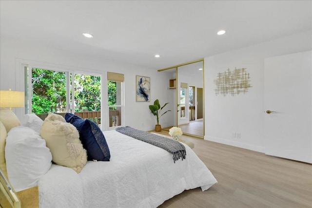 bedroom featuring light hardwood / wood-style floors and a closet