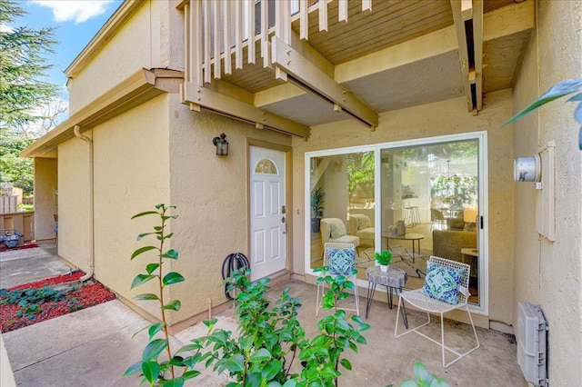 entrance to property featuring a patio area