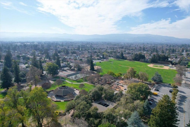 birds eye view of property with a mountain view