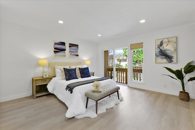 bedroom featuring access to outside and light hardwood / wood-style floors