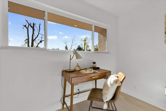 office space featuring plenty of natural light and light wood-type flooring