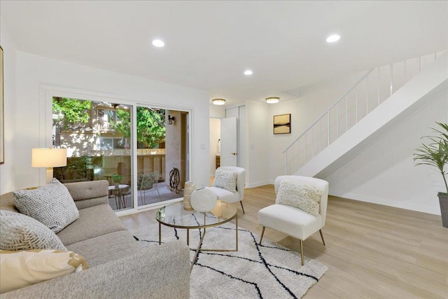 living room with light hardwood / wood-style flooring