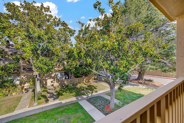 view of yard featuring a balcony