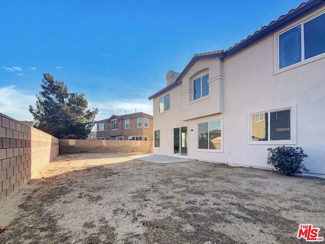 rear view of property with a patio