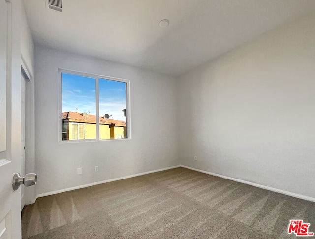 empty room featuring carpet flooring