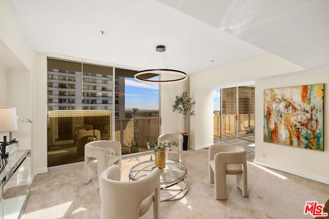 sitting room with floor to ceiling windows