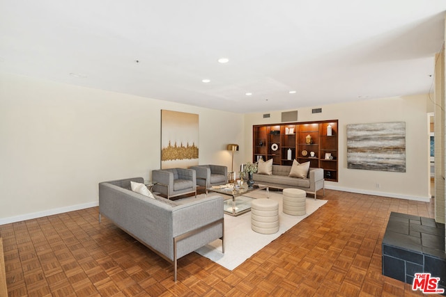 living room featuring parquet flooring