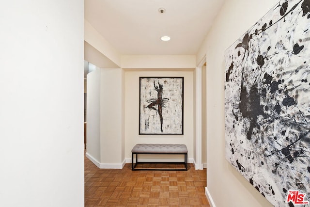 corridor with light parquet flooring