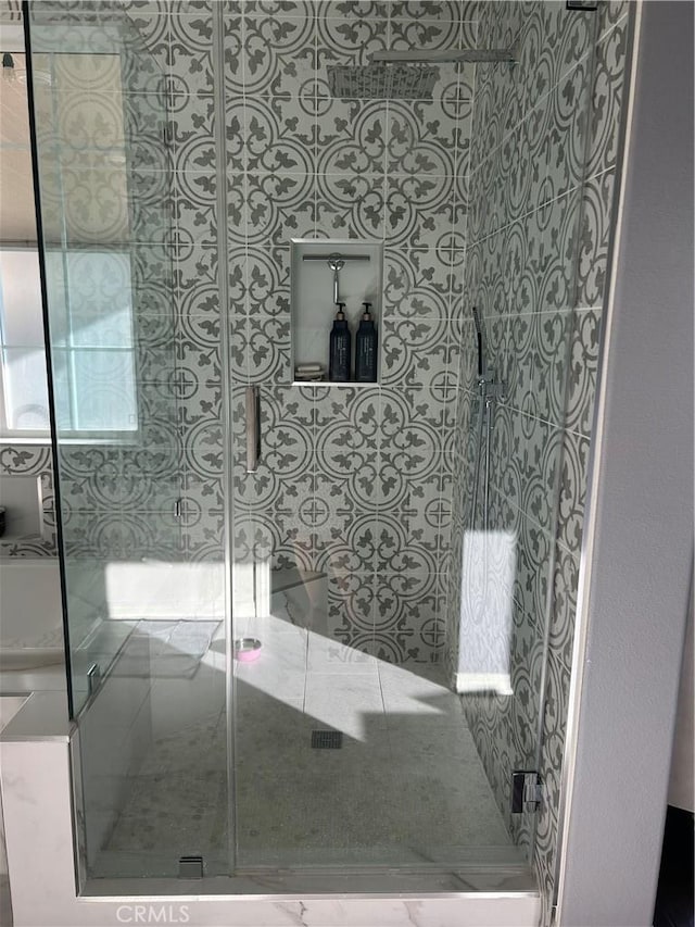 bathroom with a shower with shower door