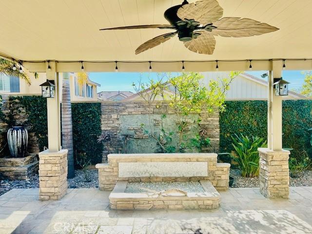 view of patio featuring ceiling fan