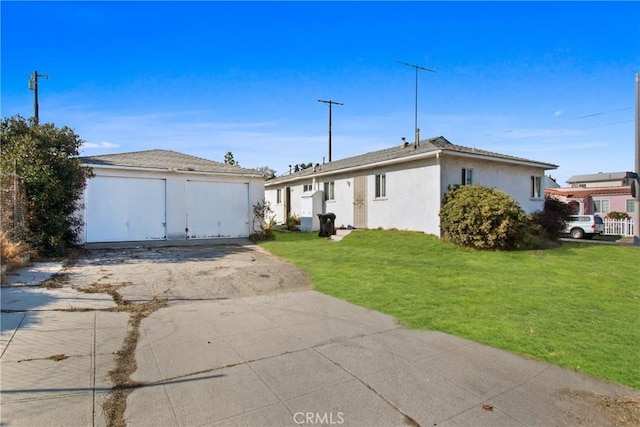 ranch-style house with a garage and a front lawn